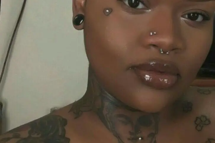 Derma piercing on black girl