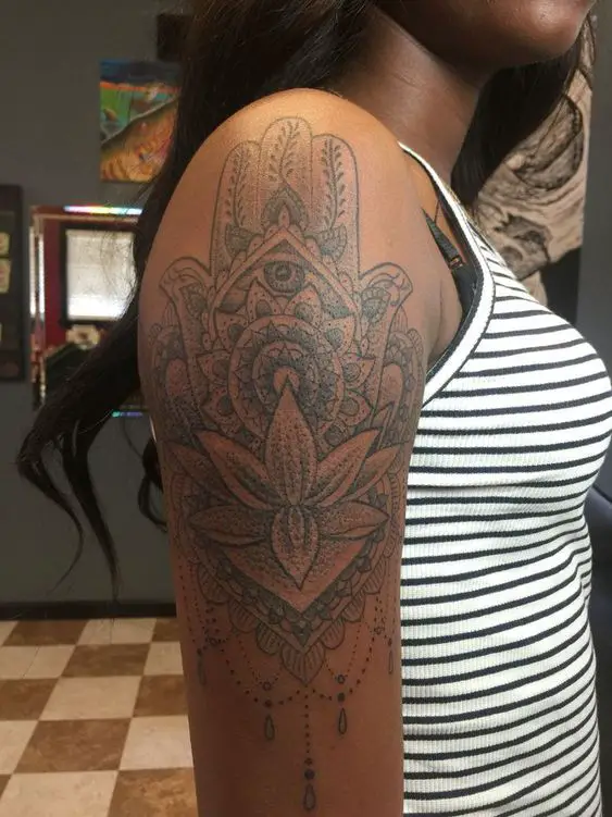 black inked girl with spiritual hand and eye design