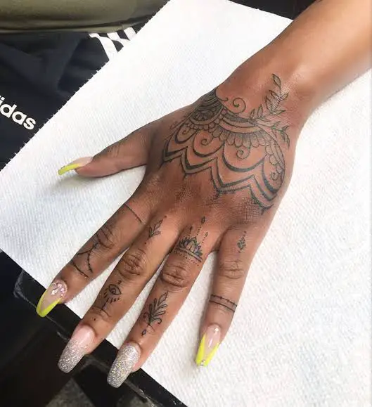 Tribal mandala hand tattoo 