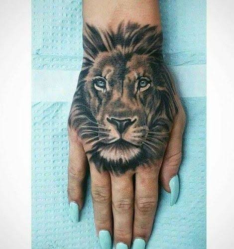 Lion head animal tattoo on the hand