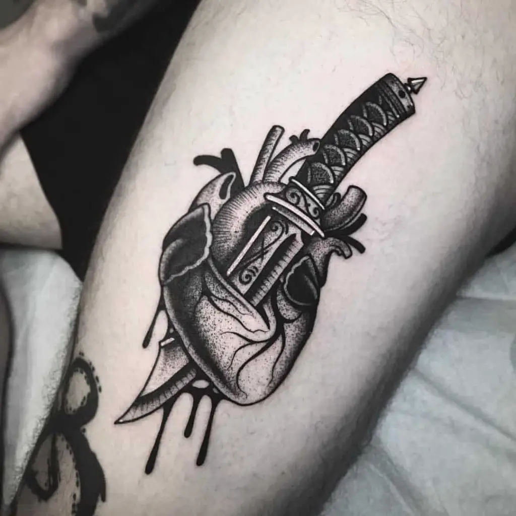 dagger hidden inside the heart tattoo