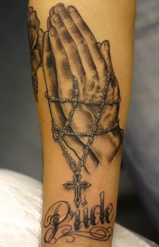 praying tattoo of a hand