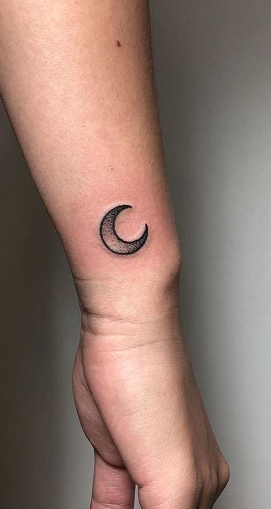 shaded halfmoon tattoo on the wrist