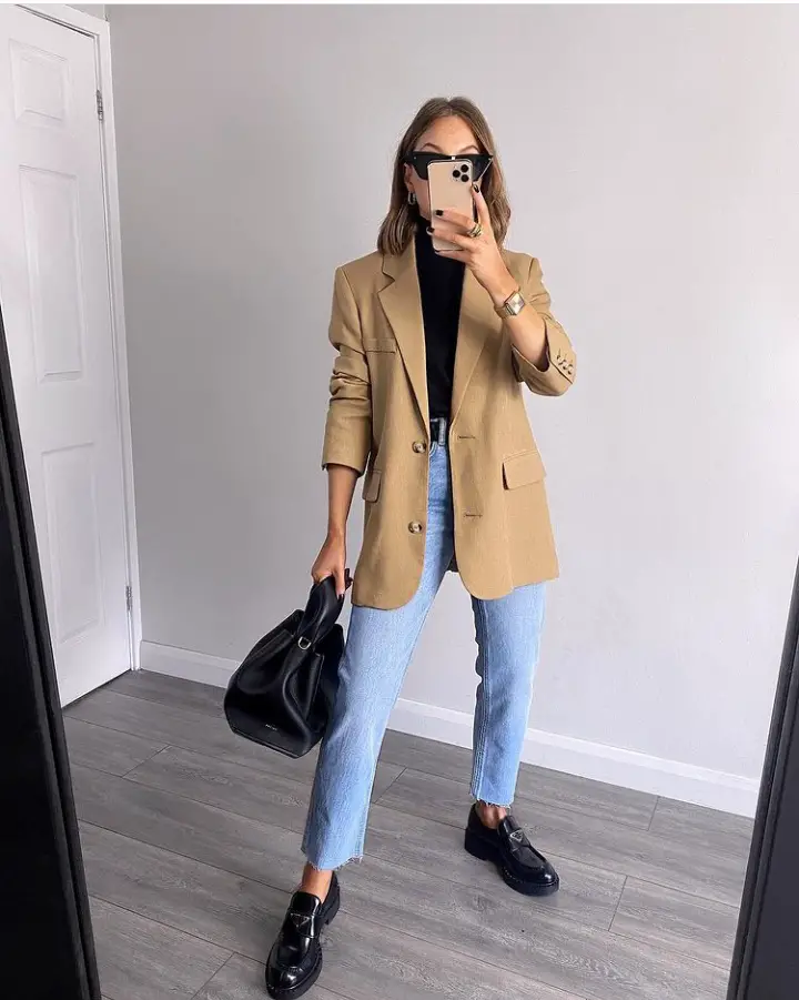 Woman in blazer and chunky loafers