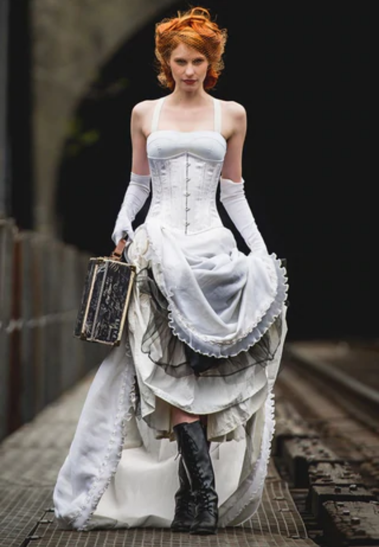 Red haired woman wearing zombie bride corset Halloween Costume