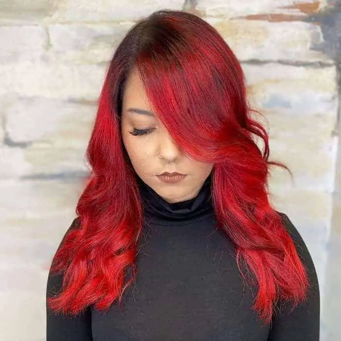 black roots with bright red hair